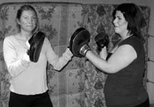 GLOVES ON: Connie Kucharski and Louisa Ring spar at the Powell River Boxing Club Powell River Pugilism